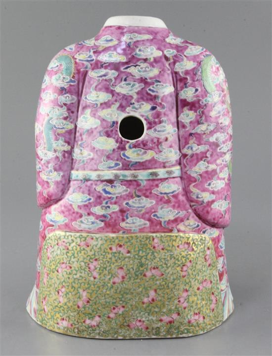 A large Chinese famille rose seated figure of an Emperor, Daoguang period (1821-50), height 30cm, cracks